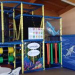 Waterworld themed indoor play structure