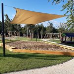 Wooden sandpit with canopy