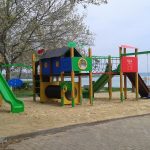 Playground complex with slides, climbing unit, bridge, swing and tunnel on the Balaton beach